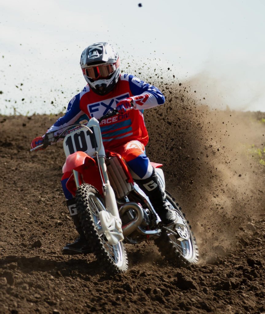 Rider roosting through a corner